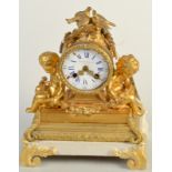 A French gilt metal mantle clock, mounted with a pair of love birds, to either side,