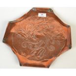 An Arts and Crafts copper tray, embossed with flowers and leaves on a textured ground.