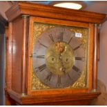 An eight day George III oak long case clock, the brass dial with a silver chapter ring and painted