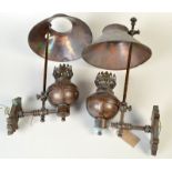 A pair of copper wall lights, each with an adjustable shade in 19th century style. Condition Report: