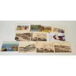 A bundle of postcards, including local and saucy seaside cards.