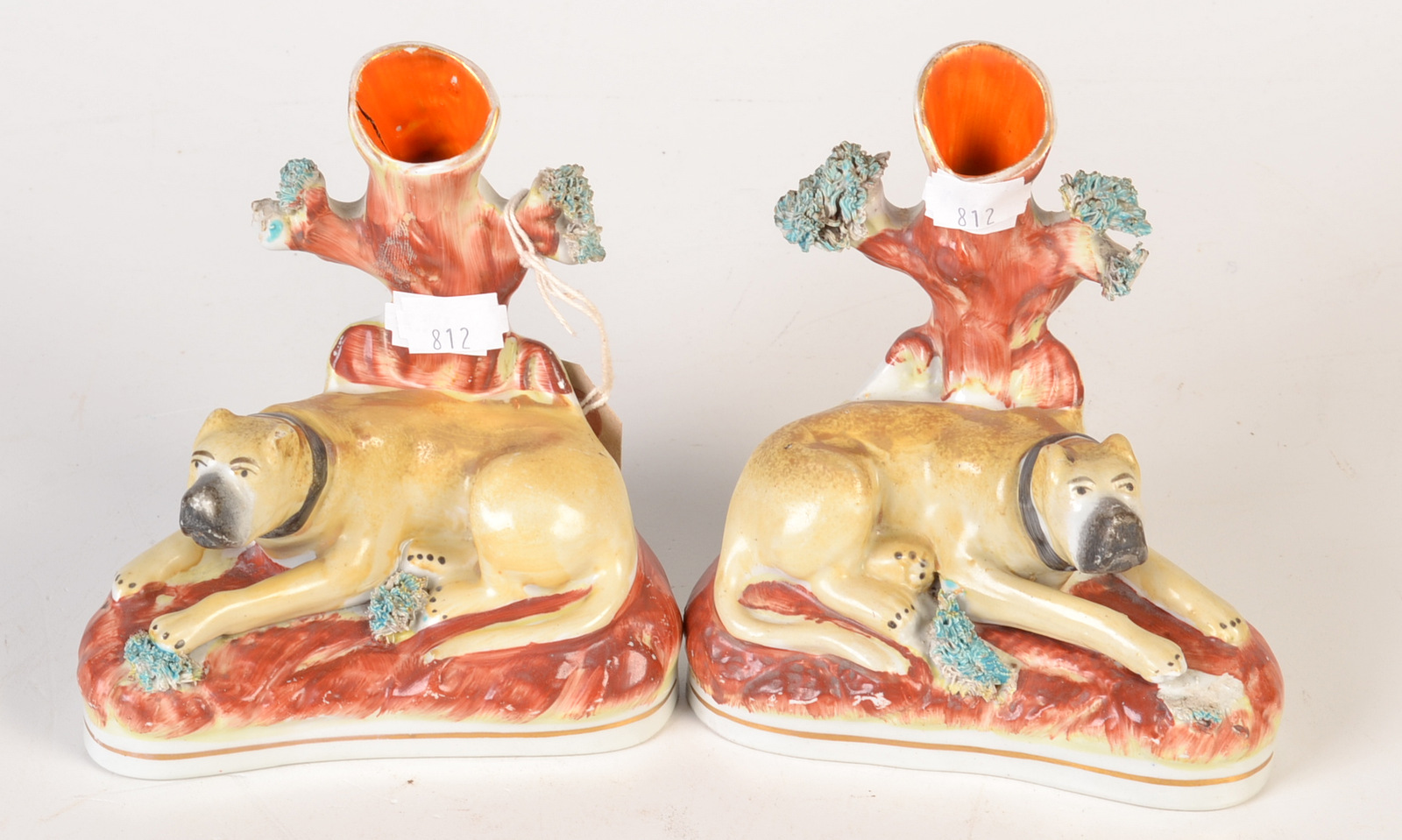 A pair of rare Staffordshire reclining mastiff spill holders. 14.5cm 

 Condition Report: Some