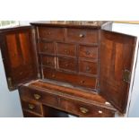 An early 18th century nest of drawers, including concealed drawers behind a pair of doors, width