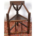 A turner's chair with triangular seat in traditional style.