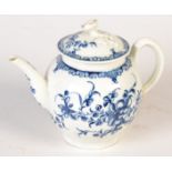 An 18th century Worcester blue and white teapot painted with flowers beneath a foliage band, the