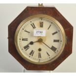 A Victorian octagonal mahogany wall clock.