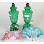 Two Victorian coloured glass baskets, two cranberry glass jugs and a pair of green glass ornaments.