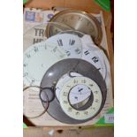 A box of clock dials etc.