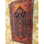 A Hamadan blue ground rug with floral pole medallion, 200 x 113cm.