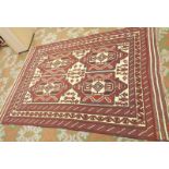A Saghari flat weave carpet with four medallions, 265 x 191cm.