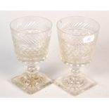 A pair of Regency style cut glass square base rummers.