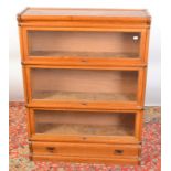 A light oak Globe Wernicke type four tier bookcase incorporating a low drawer, width 87cm,