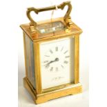 A post war brass carriage clock, signed J W Benson, London.