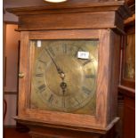 An oak and hardwood long case clock in George III style with a brass dial marked Bunster Truro