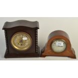 An 8 day mantle timepiece, in an arched inlaid walnut case and an oak cased mantle timepiece.