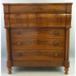 A Victorian mahogany chest of drawers, the breakfront top over a frieze drawer, over three cushion