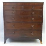 A 19th Century mahogany chest, with ebony banding, the reeded edged top over two short and four long