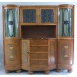A walnut, ebonised and inlaid sideboard, retailed by Hugo Wagner of Bern, of serpentine form, the