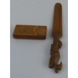 A Black Forest walnut letter opener, the handle carved as a reclining deer, 24.5cm long and a