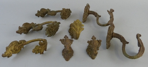 Four pairs of Victorian ormolu curtain tie backs, graduated in size and each cast with acanthus