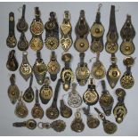 Twenty six leather mounted single horse brasses, and eight two-brass leather martingales (34)