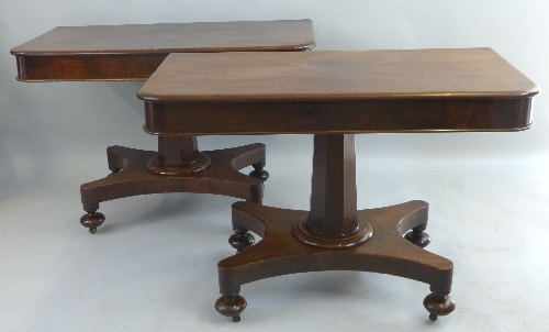 A pair of William IV mahogany side tables, having moulded edged rounded top on tapering faceted stem