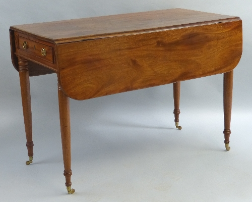 A mahogany pembroke table, having D shaped leaves over two end drawers with brass ring handles on