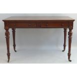 A 19th Century mahogany side table, the oblong moulded edged top having two panelled frieze drawers,