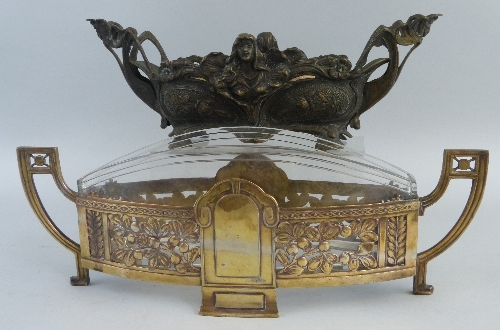 An early 20th Century Kayser table centrepiece, of oval two handled form, the brassed metal frame