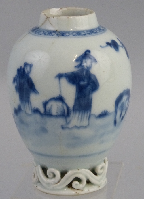 A Chinese tea caddy, probably Kangxi period, of ovoid form with pierced scrolls to the base, painted