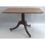 A 19th Century mahogany breakfast table, with satinwood stringing, the rounded oblong tilt top on