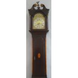 An early 19th Century longcase clock, the eight day movement with pierced arched brass dial having