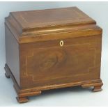 A mahogany cellarette, with satinwood and ebony banding, of oblong form with moulded hinged lid