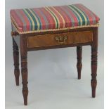 A 19th Century mahogany framed piano stool, the oblong over upholstered top having frieze drawer