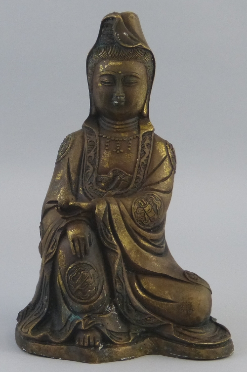 A Chinese bronze figure, of Guanyin seated in meditation, six character seal mark to the back,