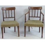 A set of six 19th Century mahogany dining chairs, including two elbow chairs with tablet crest