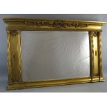 A gilt framed overmantle mirror, of oblong form with plain top, concave cornice with scrolling