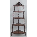 A Victorian mahogany corner whatnot, with pierced gallery over five graduated tiers having