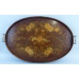 A mahogany and marquetry gallery tray, of oval form, the centre inlaid with musical trophies