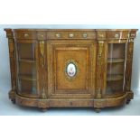 A Victorian walnut gilt metal and porcelain mounted credenza, having D shaped top over a frieze