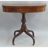 A mahogany tea table, with satinwood stringing, the D shaped fold over top on faux panelled frieze