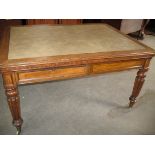 A William IV oak library table, the oblong moulded top with rounded corners and inset writing