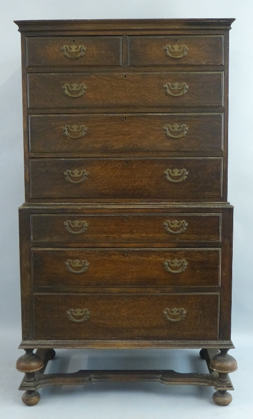 An Edwardian oak chest on chest, Queen Anne style with flared cornice over two short and three