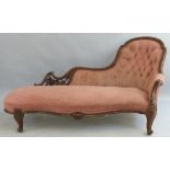 A Victorian mahogany framed chaise longue, having arched button upholstered back, upholstered arm