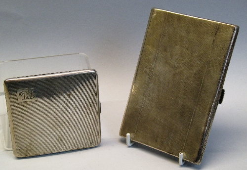 A cigarette case, of oblong form with engine turned ground, the interior with spring assisted
