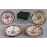 A set of five Chinese Famille Rose dishes, each enamelled to the centre with flowers and leaves