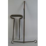 A 19th Century wrought iron two piece fireside bracket, for turning a roasting pot comprising U-