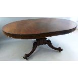 A mahogany extending dining table, in the Victorian style with one leaf, the wind out moulded