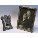A photograph frame, of plain oblong form with oblong aperture and oak back and strut support, 15cm x