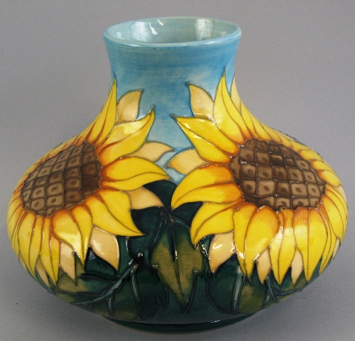 A Moorcroft vase, of flattened circular form, tube lined in the "Sun Flowers" pattern, 24cm